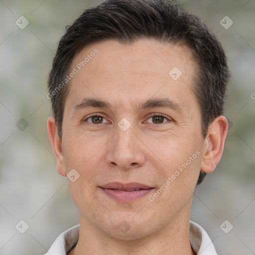 Joyful white adult male with short  brown hair and brown eyes