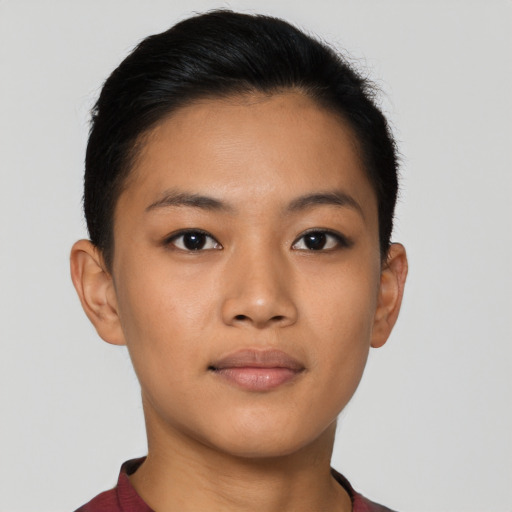Joyful latino young-adult female with short  brown hair and brown eyes