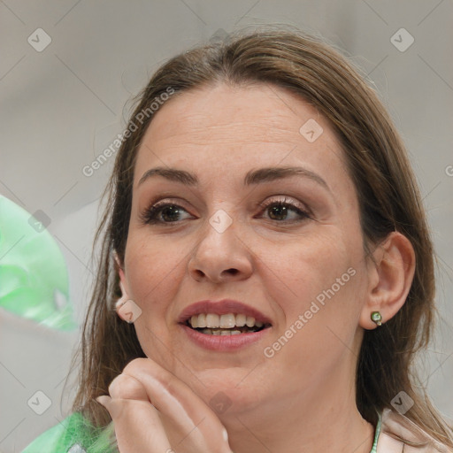 Joyful white adult female with medium  brown hair and brown eyes