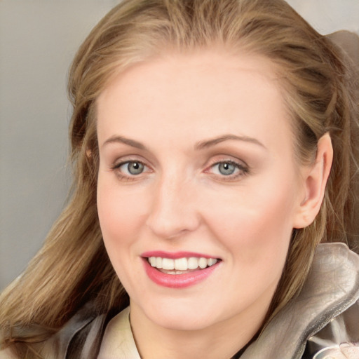 Joyful white young-adult female with long  brown hair and blue eyes