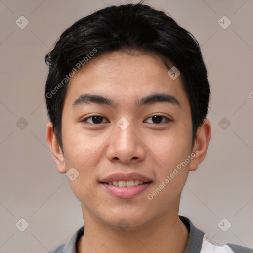 Joyful asian young-adult male with short  black hair and brown eyes