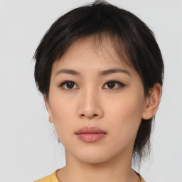 Neutral asian young-adult female with medium  brown hair and brown eyes