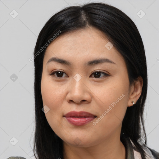 Joyful asian young-adult female with long  brown hair and brown eyes