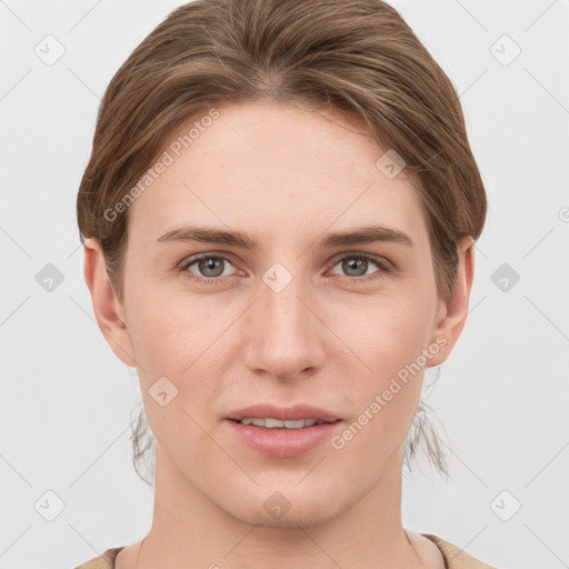 Joyful white young-adult female with short  brown hair and grey eyes