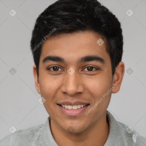 Joyful latino young-adult male with short  black hair and brown eyes