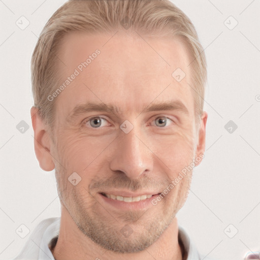 Joyful white adult male with short  brown hair and grey eyes