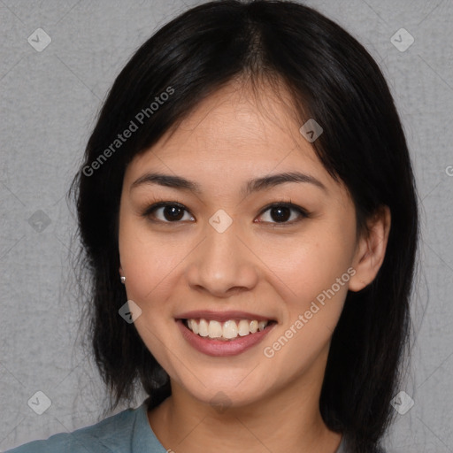 Joyful asian young-adult female with medium  black hair and brown eyes