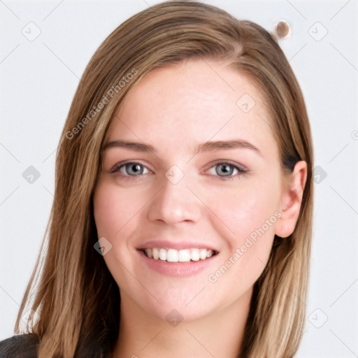 Joyful white young-adult female with long  brown hair and blue eyes