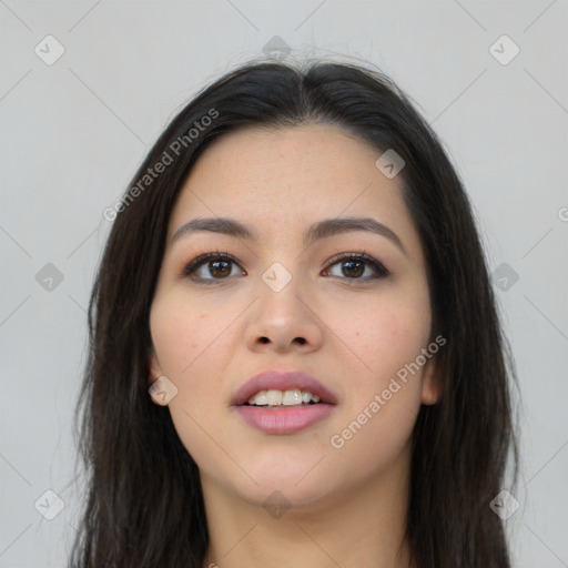 Joyful asian young-adult female with long  black hair and brown eyes