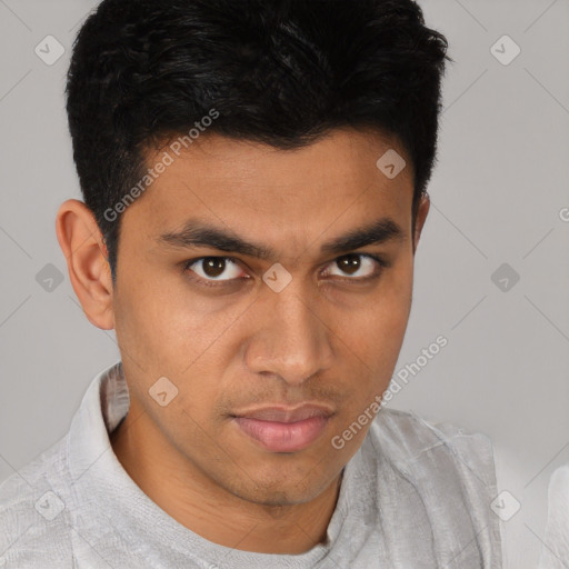 Joyful latino young-adult male with short  brown hair and brown eyes