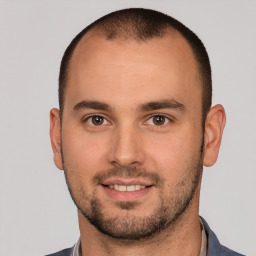 Joyful white young-adult male with short  brown hair and brown eyes