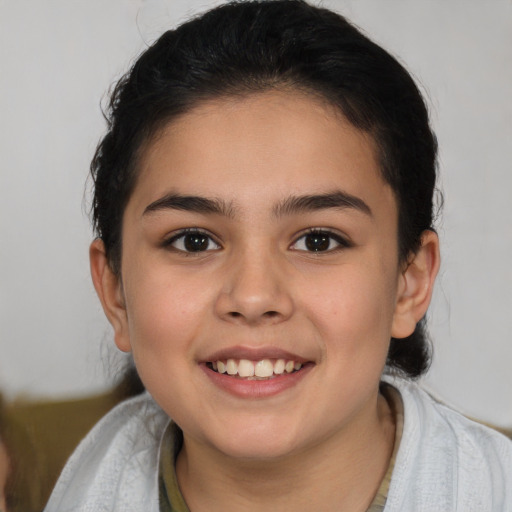 Joyful white child female with short  brown hair and brown eyes