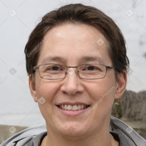 Joyful white adult female with short  brown hair and brown eyes