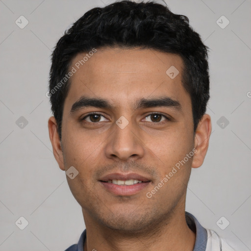 Joyful white young-adult male with short  black hair and brown eyes