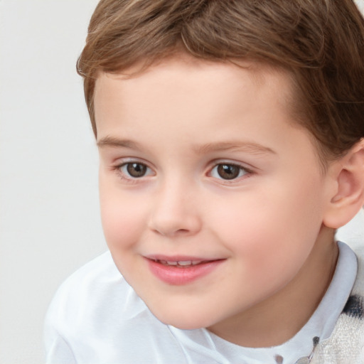 Joyful white child male with short  brown hair and brown eyes