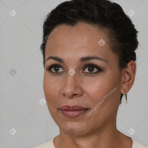 Joyful black young-adult female with short  brown hair and brown eyes