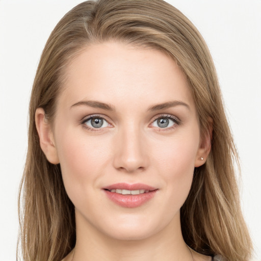 Joyful white young-adult female with long  brown hair and grey eyes