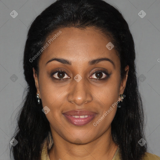 Joyful black young-adult female with long  brown hair and brown eyes