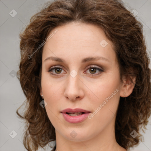 Joyful white young-adult female with medium  brown hair and green eyes