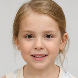 Joyful white child female with medium  brown hair and brown eyes