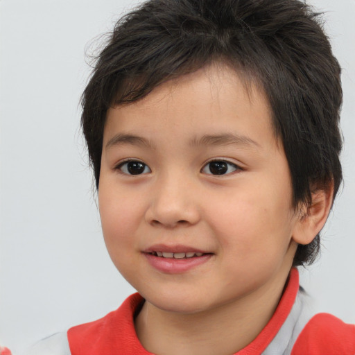 Joyful white child female with short  brown hair and brown eyes