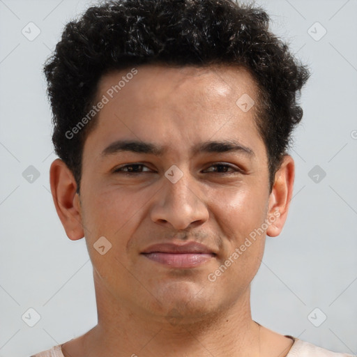 Joyful latino young-adult male with short  brown hair and brown eyes