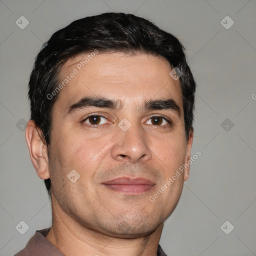 Joyful white adult male with short  brown hair and brown eyes