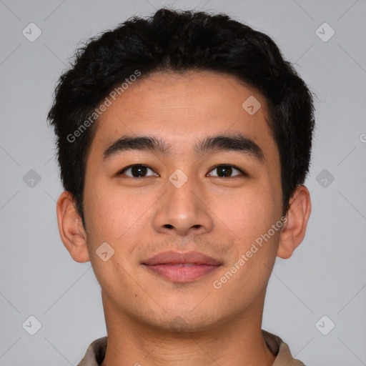 Joyful asian young-adult male with short  black hair and brown eyes