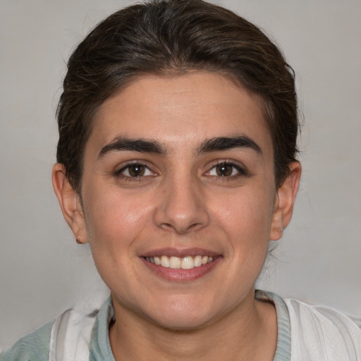 Joyful white young-adult female with medium  brown hair and brown eyes