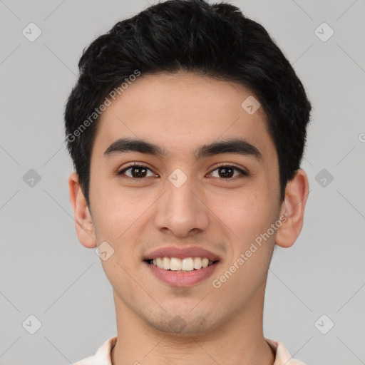 Joyful asian young-adult male with short  black hair and brown eyes