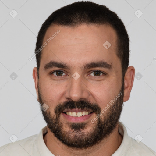 Joyful white young-adult male with short  black hair and brown eyes