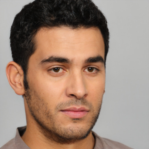 Neutral latino young-adult male with short  black hair and brown eyes