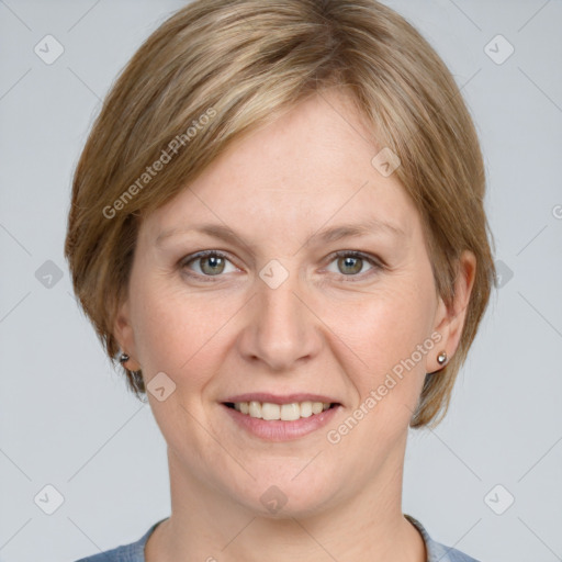 Joyful white adult female with medium  brown hair and grey eyes