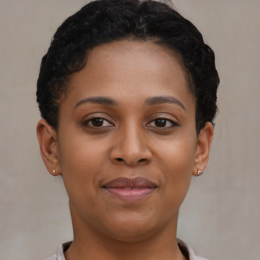 Joyful latino young-adult female with short  brown hair and brown eyes