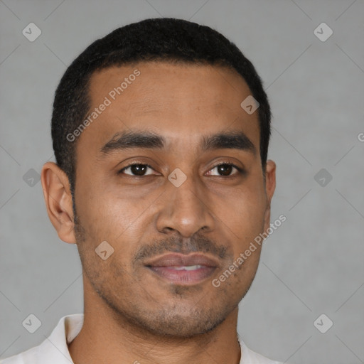 Joyful latino young-adult male with short  brown hair and brown eyes