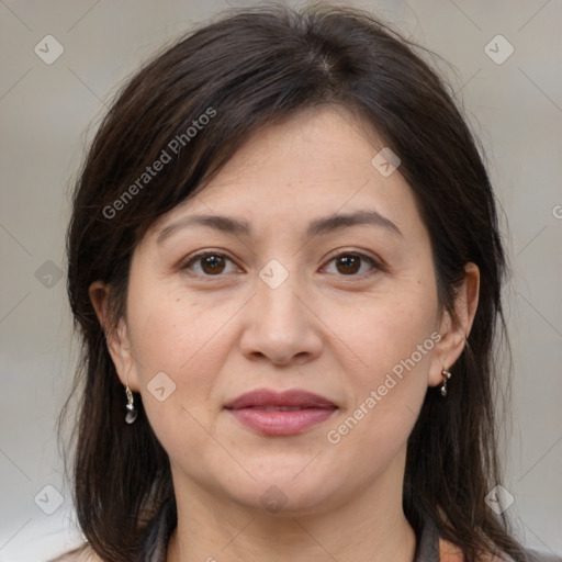 Joyful white adult female with medium  brown hair and brown eyes