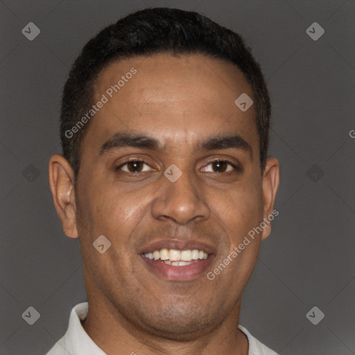 Joyful black young-adult male with short  brown hair and brown eyes