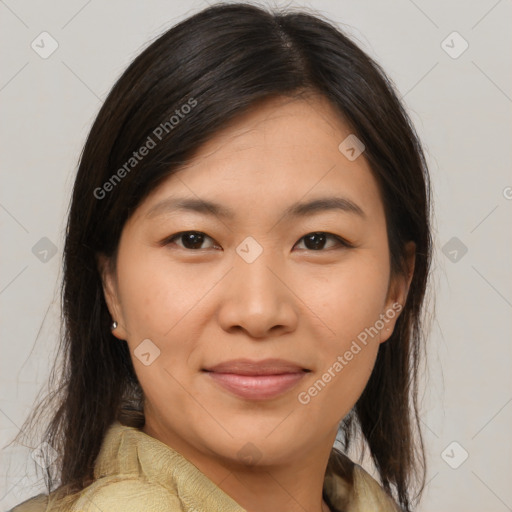 Joyful asian young-adult female with medium  brown hair and brown eyes