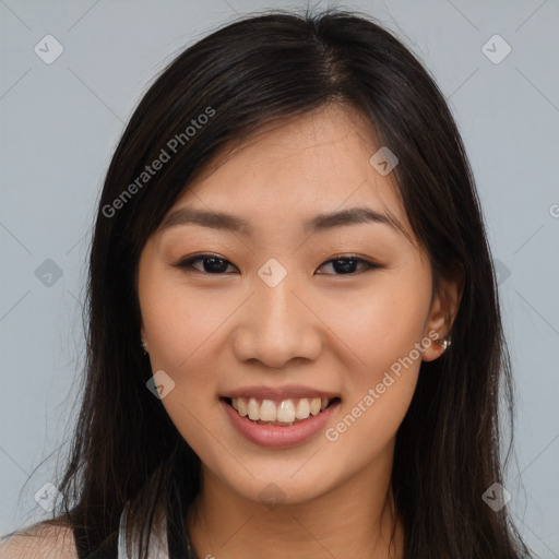 Joyful asian young-adult female with long  brown hair and brown eyes