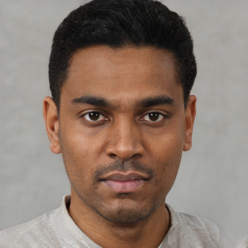 Neutral latino young-adult male with short  black hair and brown eyes