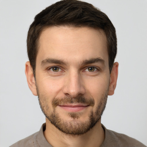 Joyful white young-adult male with short  brown hair and brown eyes