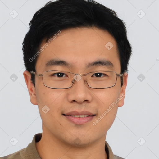 Joyful asian young-adult male with short  brown hair and brown eyes