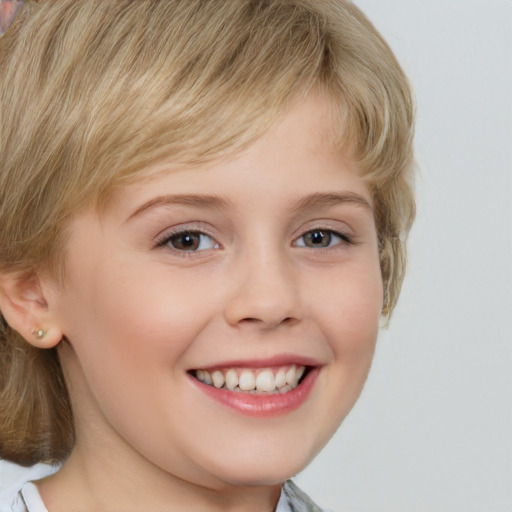 Joyful white child female with medium  brown hair and grey eyes