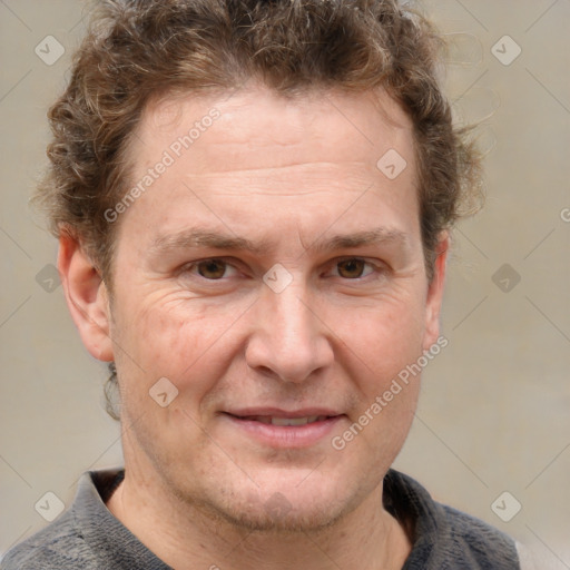 Joyful white adult male with short  brown hair and grey eyes