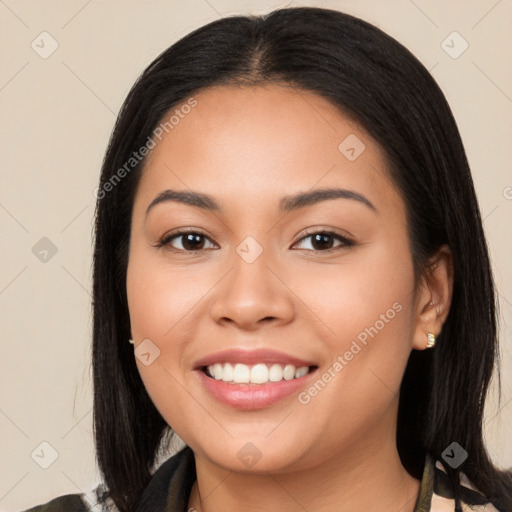 Joyful latino young-adult female with long  black hair and brown eyes