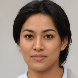 Joyful asian young-adult female with medium  brown hair and brown eyes