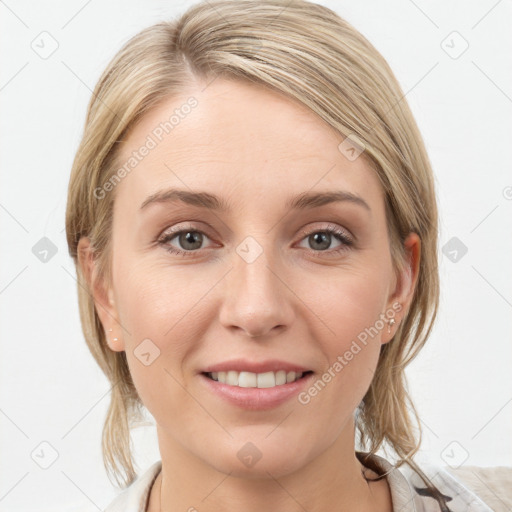 Joyful white young-adult female with medium  brown hair and grey eyes