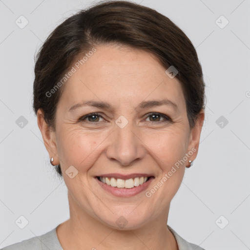 Joyful white adult female with short  brown hair and brown eyes