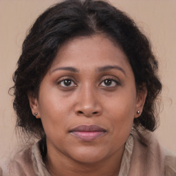 Joyful asian young-adult female with long  brown hair and brown eyes