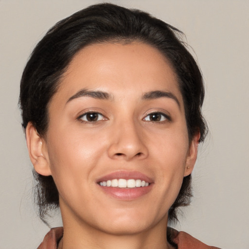 Joyful white young-adult female with medium  brown hair and brown eyes